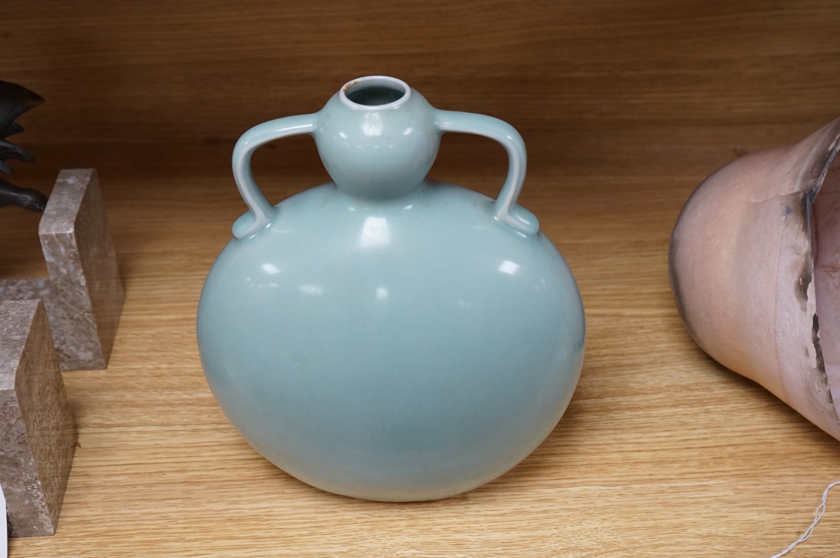 A Chinese celadon glazed two handled moon vase, 24cm high